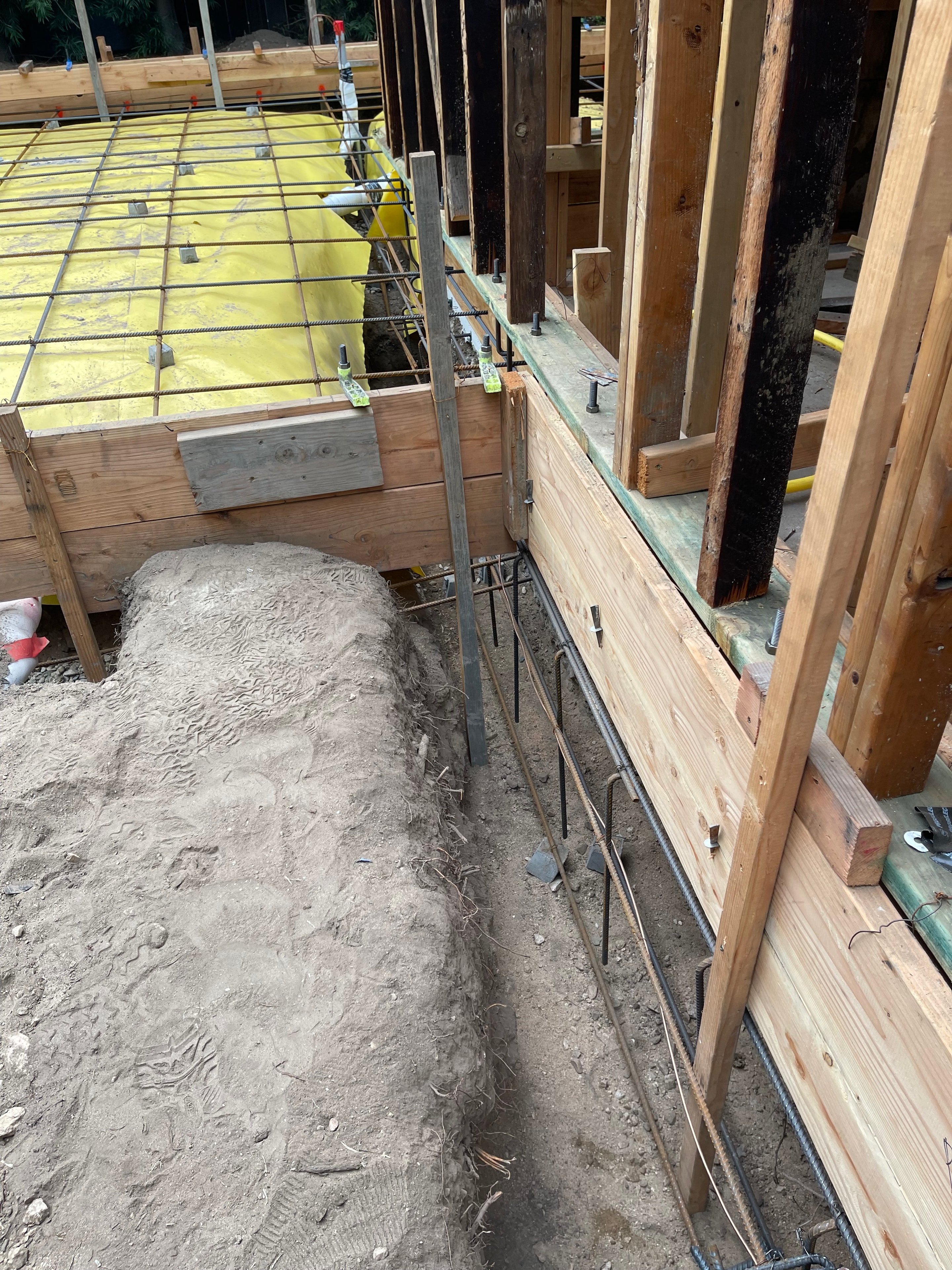 Foundation underpinning with rebar cage and formwork beneath an existing Pasadena home — Concrete Etc., Inc.