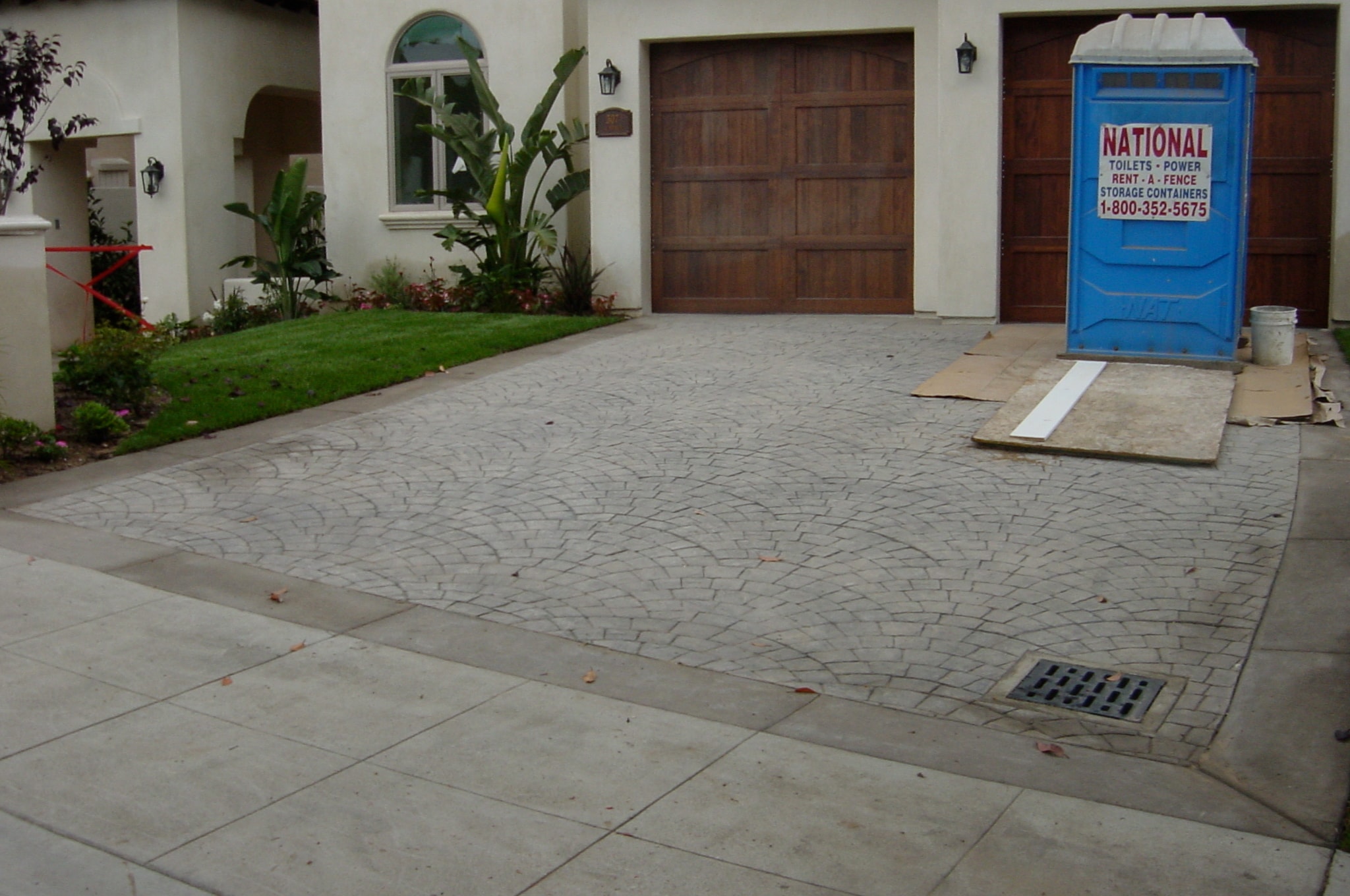 Ashlar flagstone pattern stamped concrete driveway under construction in Los Angeles by Concrete Etc., Inc.