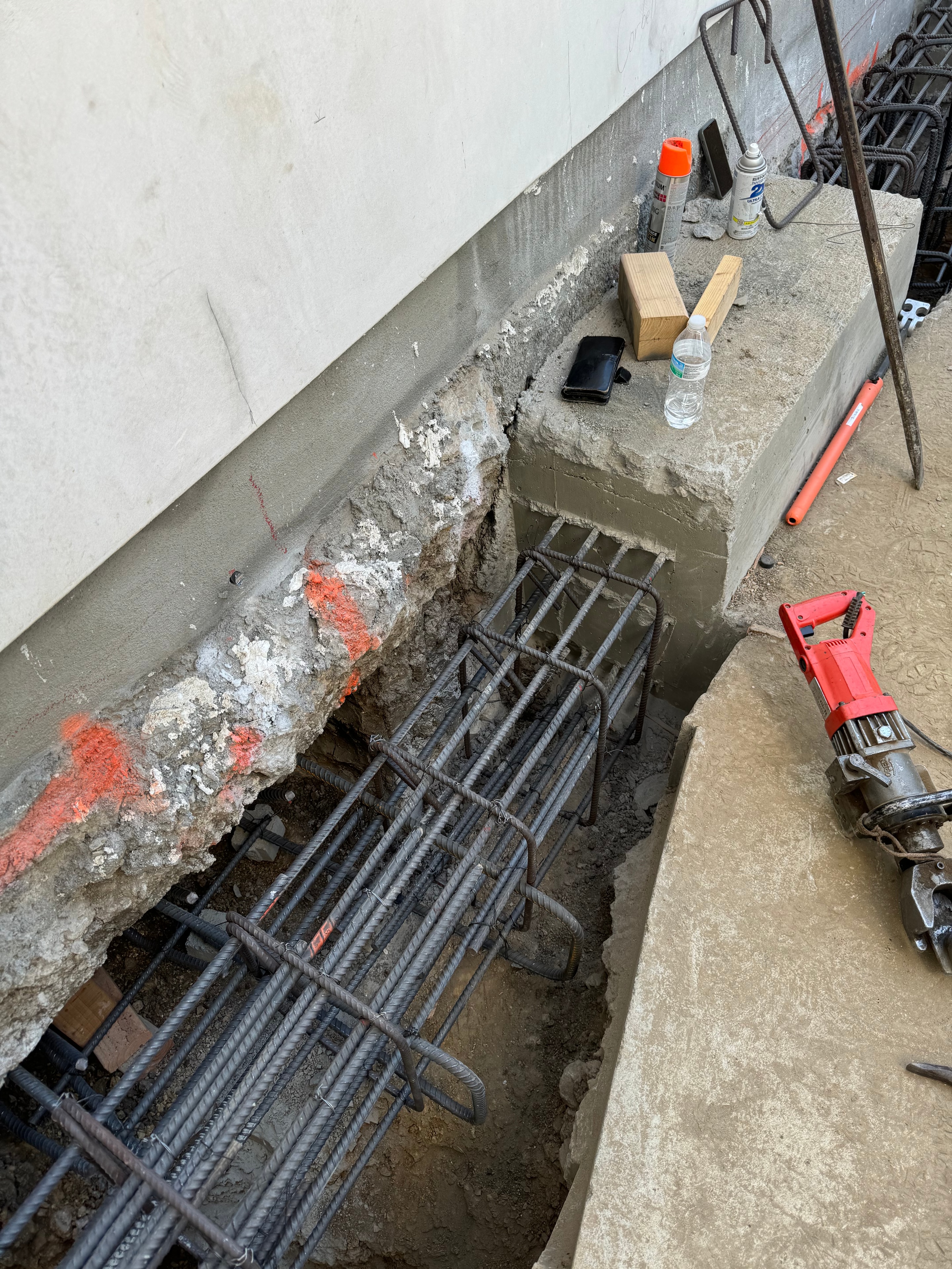 Concrete foundation underpinning with heavy rebar cage and excavation for structural reinforcement in Santa Clarita, CA by Concrete Etc., Inc.
