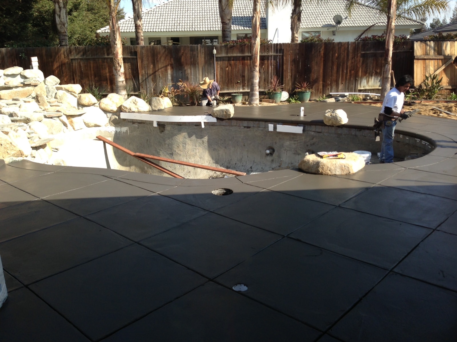 Concrete pool deck installation in progress with fresh pour and score lines in Santa Clarita Valley by Concrete Etc., Inc.