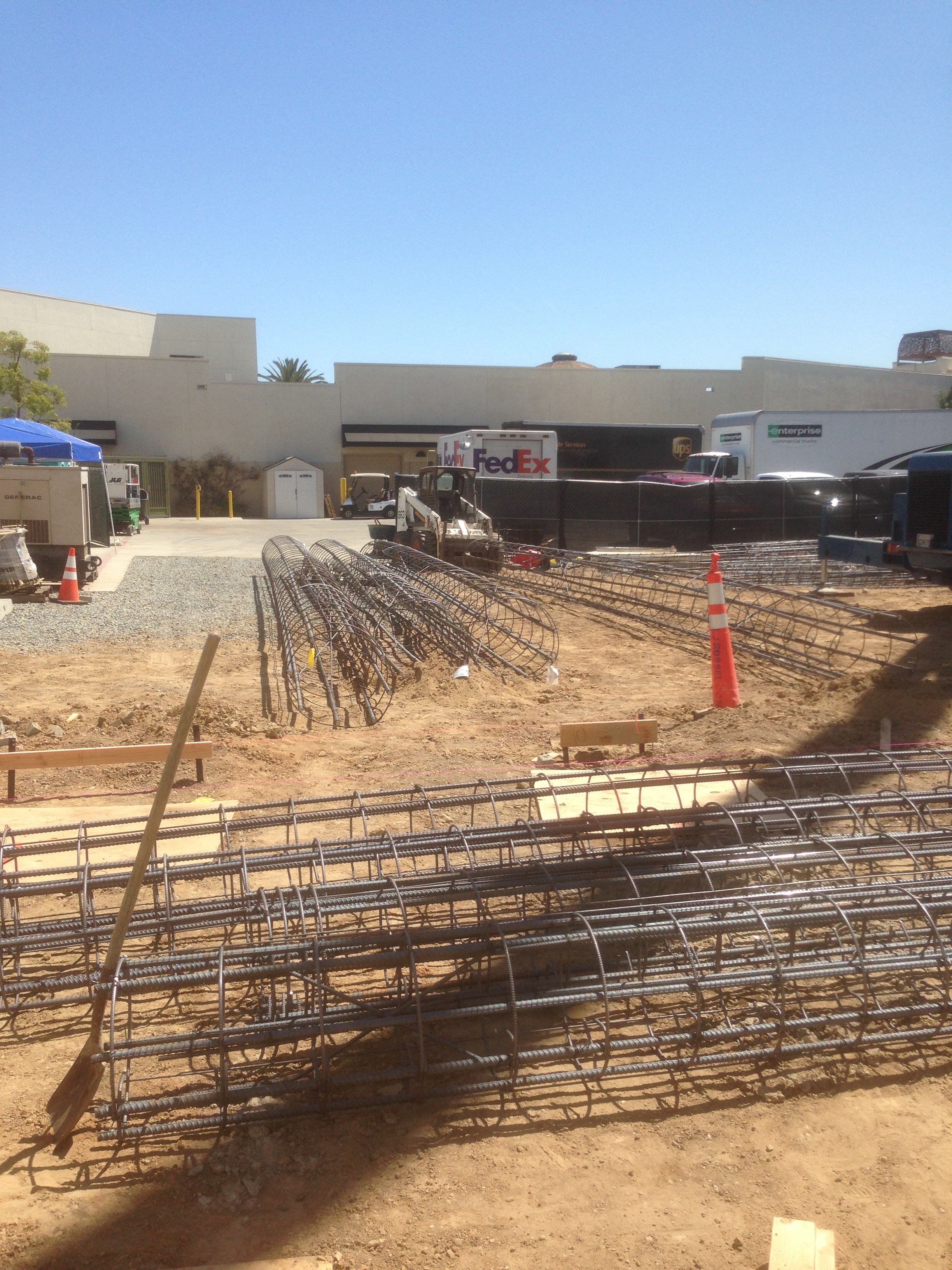 Rebar mats and caisson cages staged on commercial construction site in Los Angeles County — Concrete Etc., Inc.