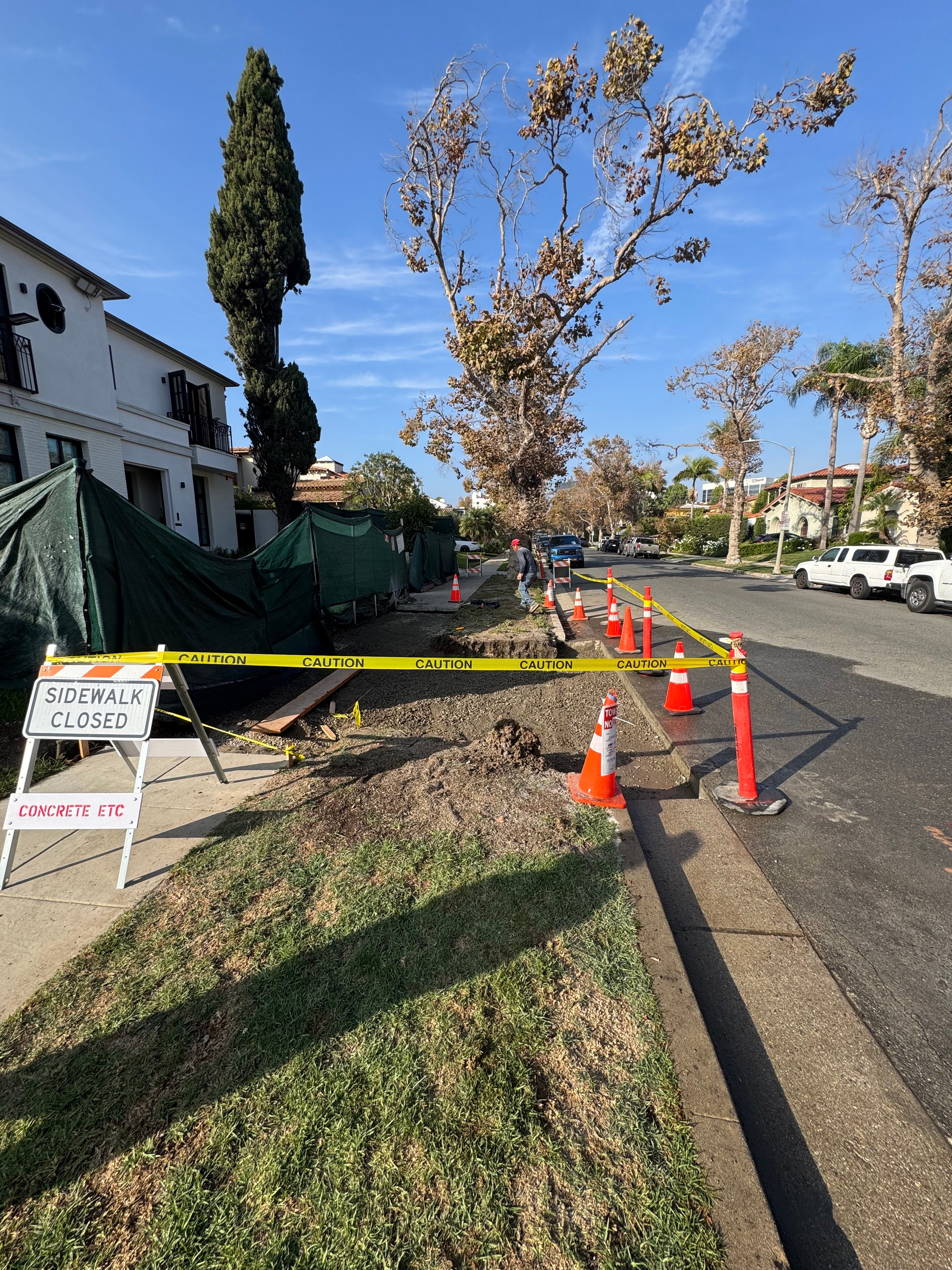 Concrete Etc. sidewalk repair with caution tape and traffic cones in Los Angeles County