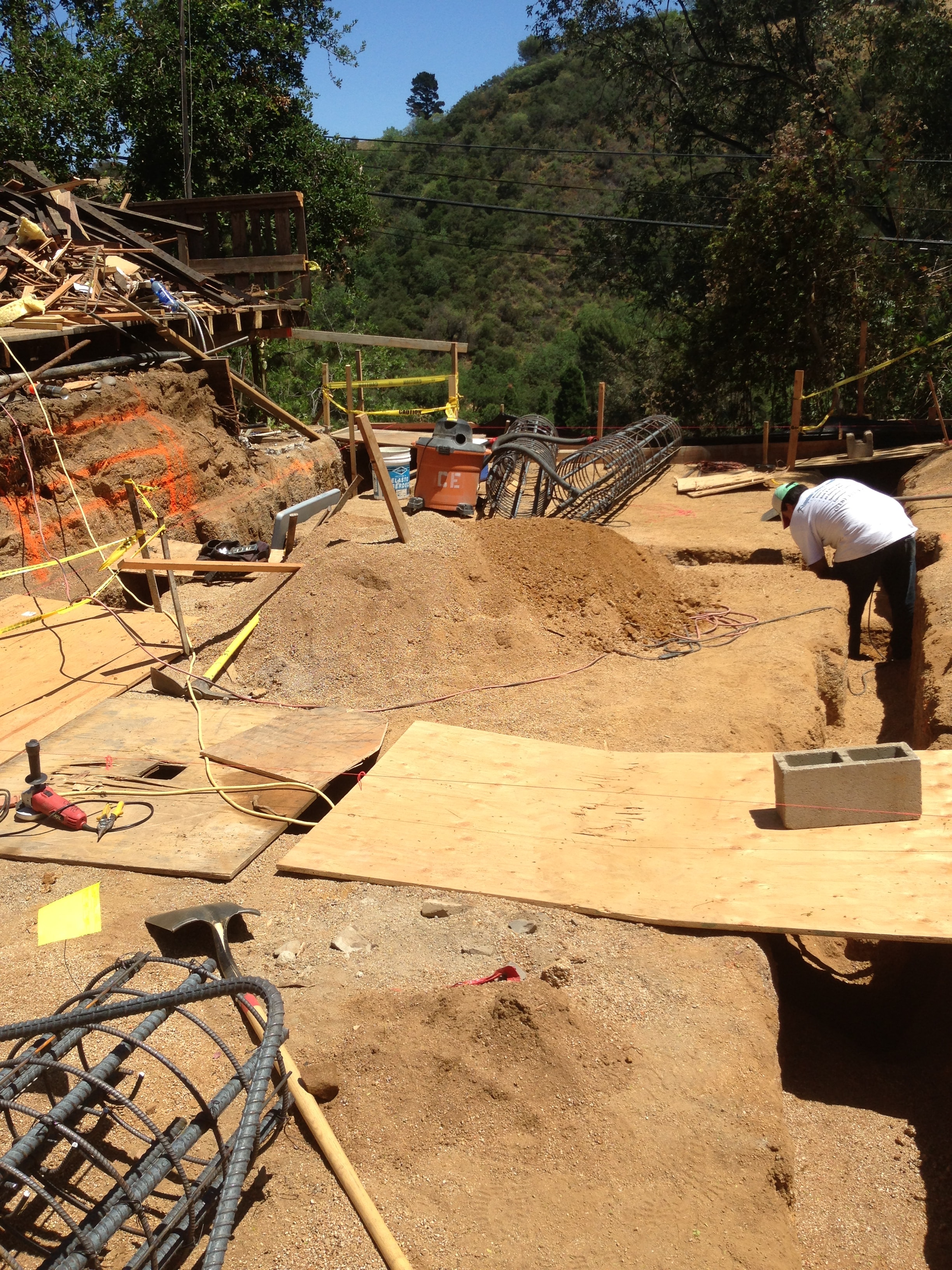 Grade beam rebar layout and formwork for hillside foundation construction in Los Angeles County by Concrete Etc., Inc.