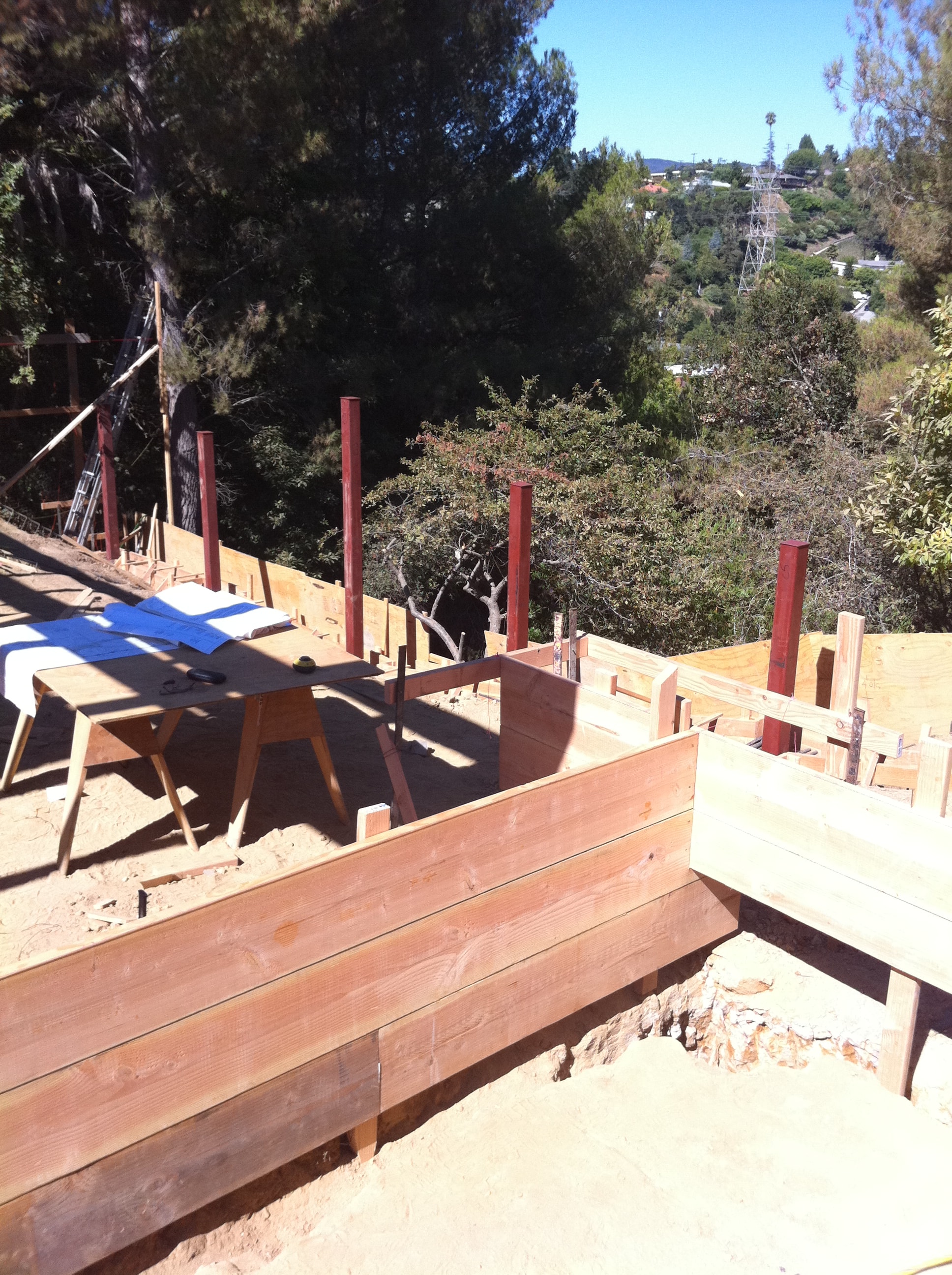 Steel frame and grade beam construction on hillside lot in Los Angeles County by Concrete Etc., Inc.