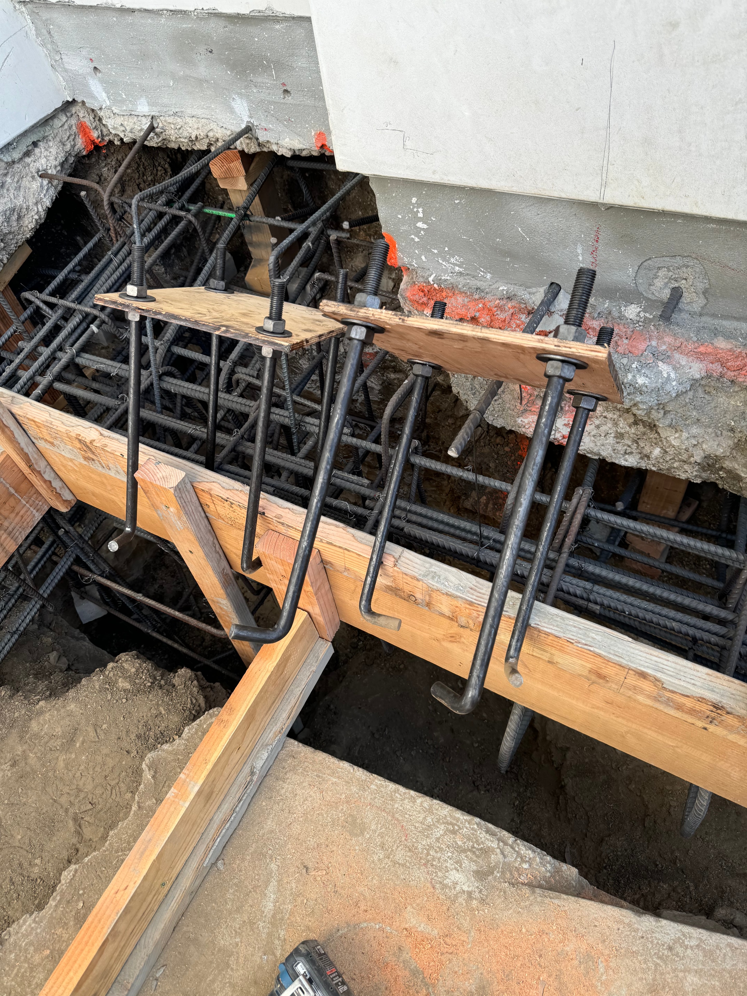 Rebar cage assembly for caisson and underpinning foundation on hillside lot in Los Angeles County by Concrete Etc., Inc.