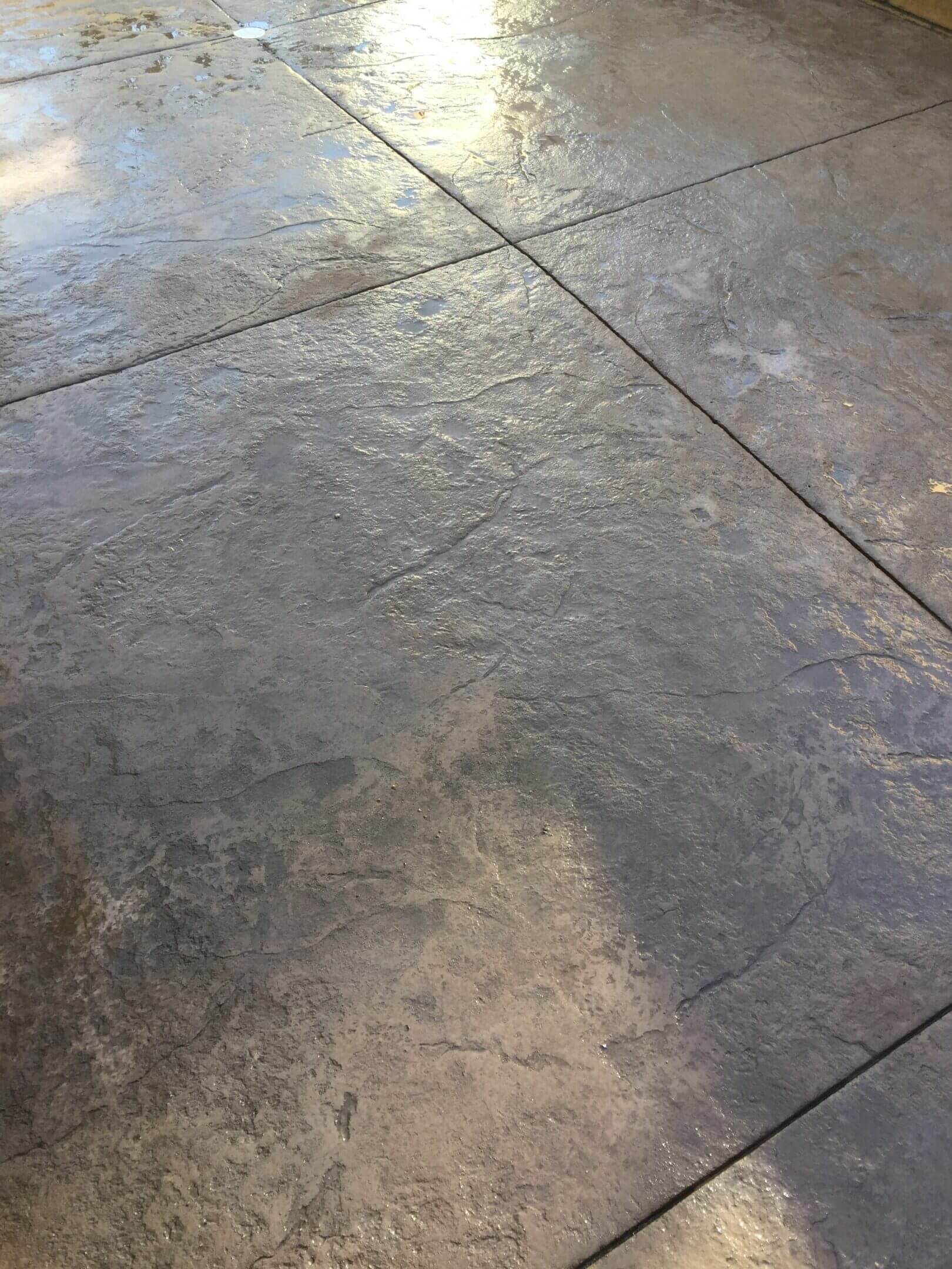 Stamped concrete surface with textured natural stone finish installed in Santa Clarita by Concrete Etc Inc